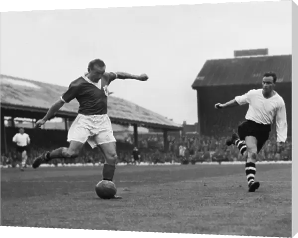 Stanley Matthews crosses the ball for Blackpool against Luton Town in 1957