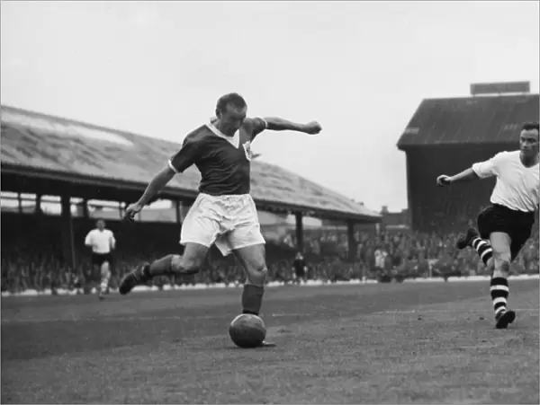 Stanley Matthews crosses the ball for Blackpool against Luton Town in 1957