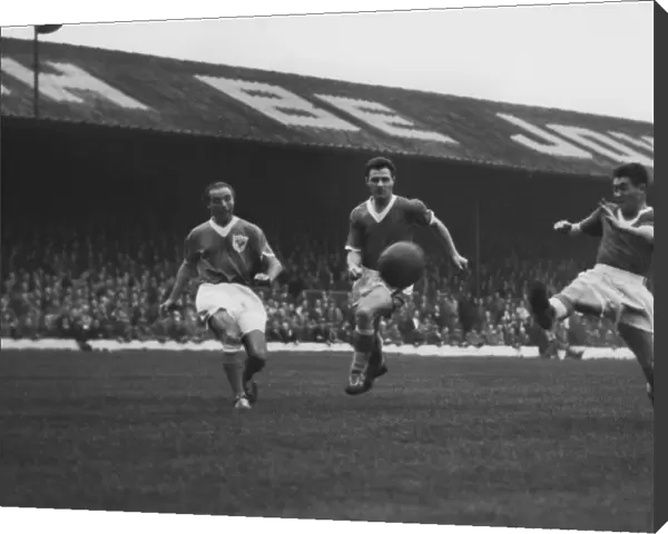 Stanley Matthews competes with John Bramwell and Bobby Collins for the ball in 1958