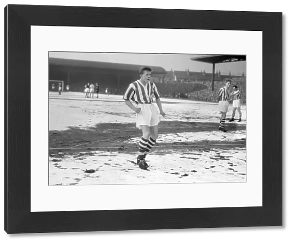 A 16 year-old Denis Law in the snow for Huddersfield in the FA Cup