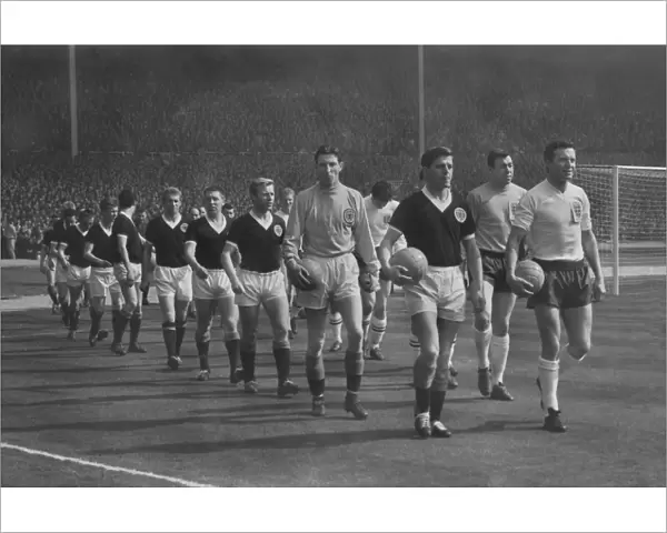 Englands Jimmy Armfield and Scotlands Eric Caldow lead out their teams at Wembley during the 1963 Home Championship