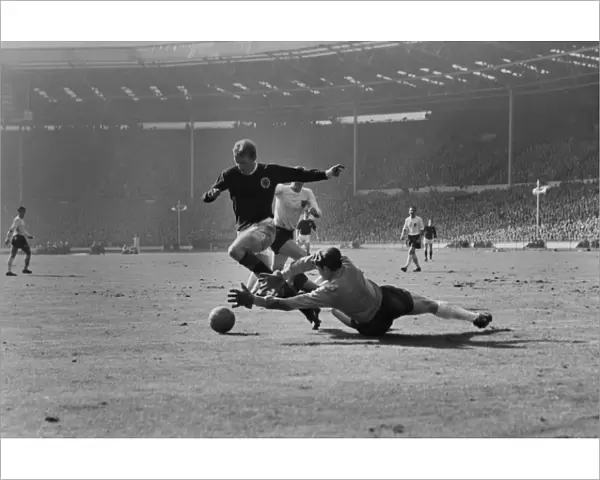Scotlands Denis Law rounds Englands goalkeeper Gordon Banks to score at Wembley in 1965