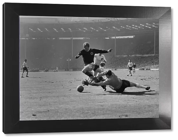 Scotlands Denis Law rounds Englands goalkeeper Gordon Banks to score at Wembley in 1965