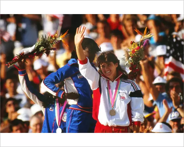 Kathy Cook waves to the crowd on the podium at the 1984 Los Angeles Olympics