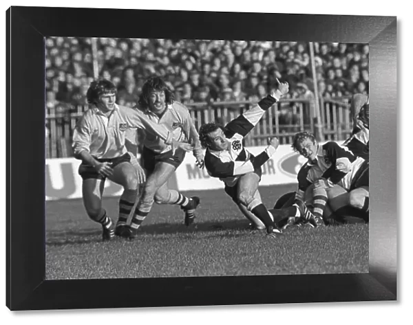 Gareth Edwards passes the ball away for the Barbarians in 1976