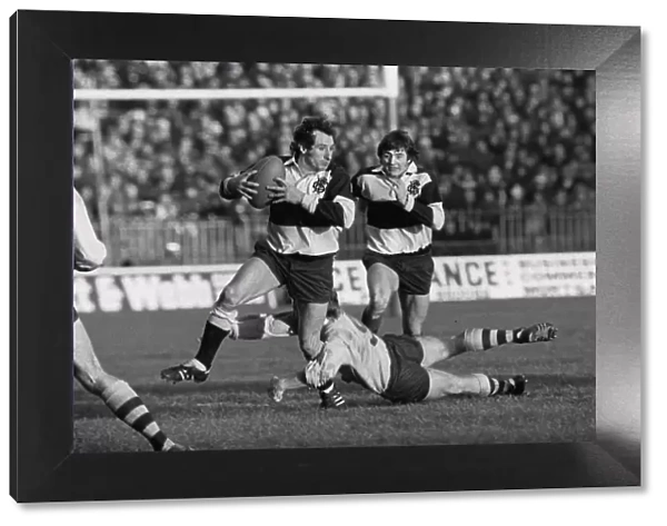 Gareth Edwards makes a break for the Barbarians in 1976