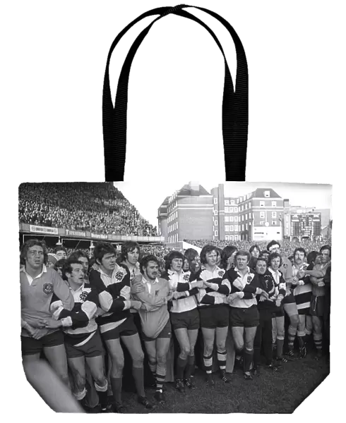 The two sides link hands at the end of the match after the Barbarians defeat the Australians in 1976