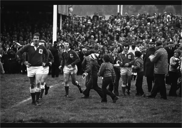The Stradey Park crowd invade the pitch after JJ Williams try against Australia in 1975