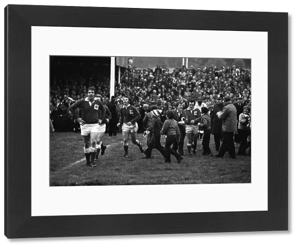 The Stradey Park crowd invade the pitch after JJ Williams try against Australia in 1975