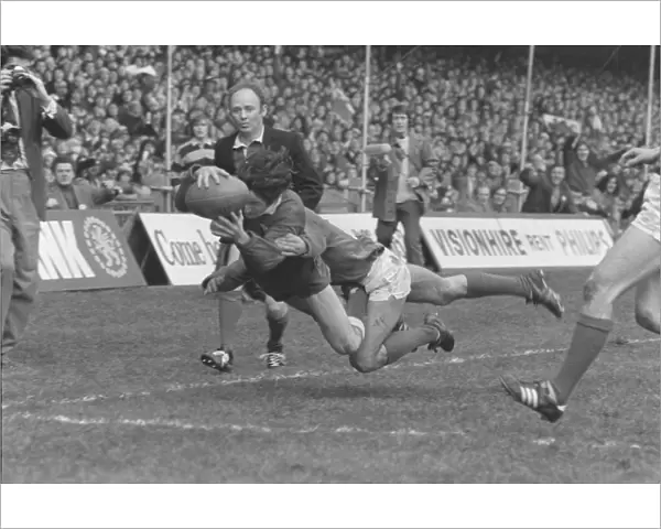 Gerald Davies dives into the corner to score during the 1974 Five Nations