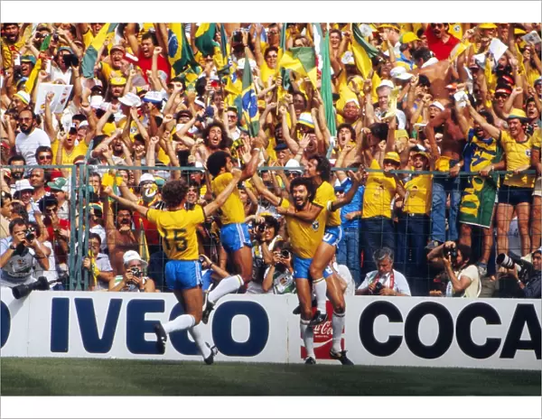 Socrates celebrates with his teammates after scoring for Brazil at the 1982 World Cup