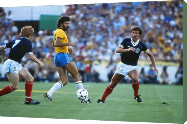 Brazils Socrates takes on Scotland at the 1982 World Cup