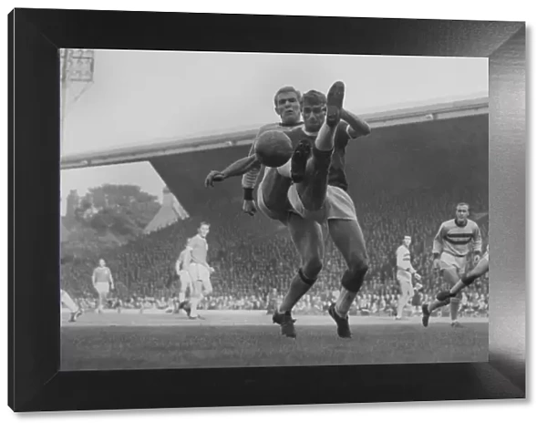 Bobby Moore and Roger Hunt challenge for the ball at Anfield in 1963