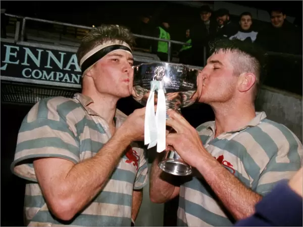 The Innes Brother kiss the Bowring Bowl after Cambridges victory in the 1998 Varsity Match