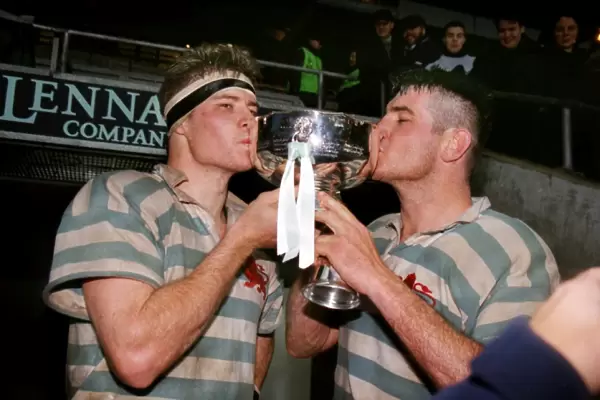 The Innes Brother kiss the Bowring Bowl after Cambridges victory in the 1998 Varsity Match