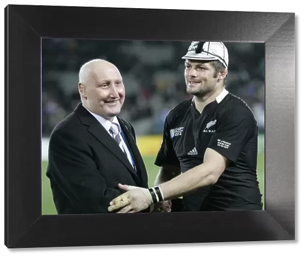 Former All Black Jock Hobbs presents Richie McCaw with his 100th cap