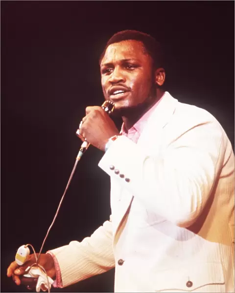 + Heavyweight Boxer Joe Frazier of USA singing during a show in Munich in 1971