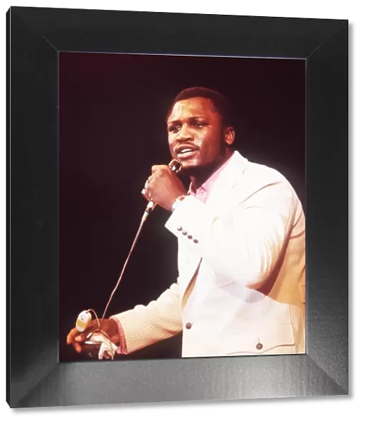 + Heavyweight Boxer Joe Frazier of USA singing during a show in Munich in 1971