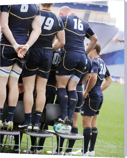Scotlands Scott Lawson, placed in the back row, has to stand on a rugby ball for the team photo at the World Cup