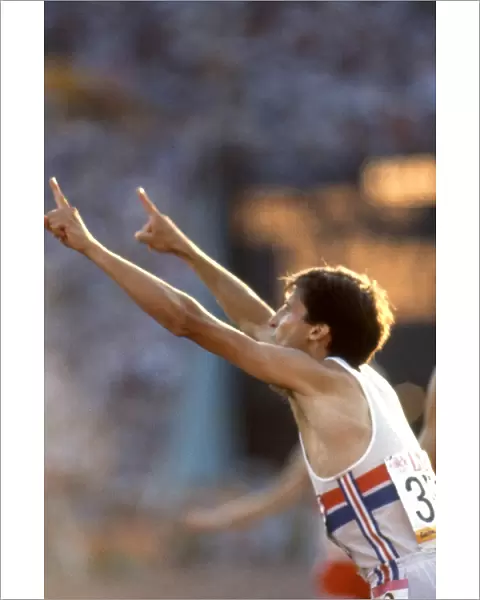 Seb Coe gestures to the press that he is no. 1 after retaining his 1500m Olympic title in Los Angeles in 1984
