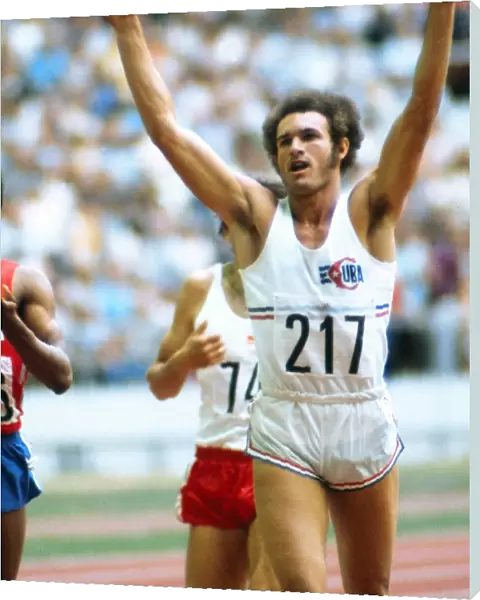 Cubas Alberto celebrates completing the 400m  /  800m double at the 1976 Montreal Olympics