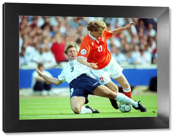 Stuart Pearce puts in a tackle at Euro 96