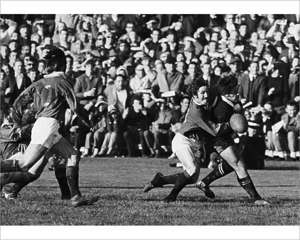British Lions winger Gerald Davies tackles All Blacks winger Bryan Williams without the ball, resulting in referee John Pring awarded the All Blacks a penalty try during the 2nd Test of the 1971 Tour