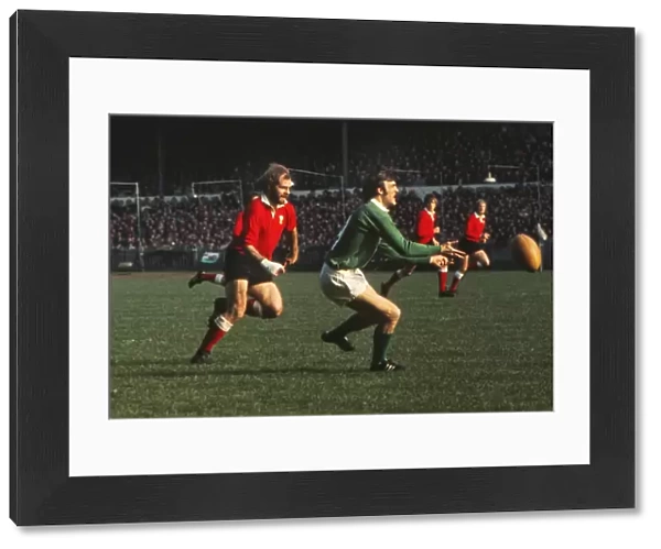 John Taylor puts pressure on John Moloney during the 1973 Five Nations