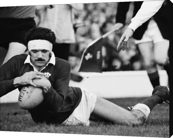 Mervyn Davies scores a try during the 1974 Five Nations