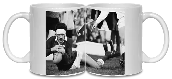 Mervyn Davies scores a try during the 1974 Five Nations