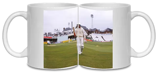 Michael Atherton walks back to the pavillion after scoring his maiden Test century