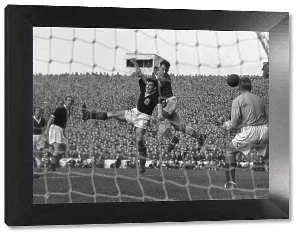 John Charles rises to win a header during the 1957 Home Championship