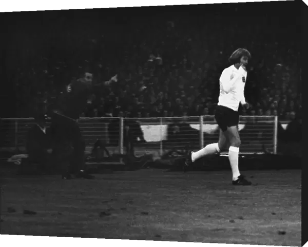 Rodney Marsh runs onto the Wembley pitch to make his England debut