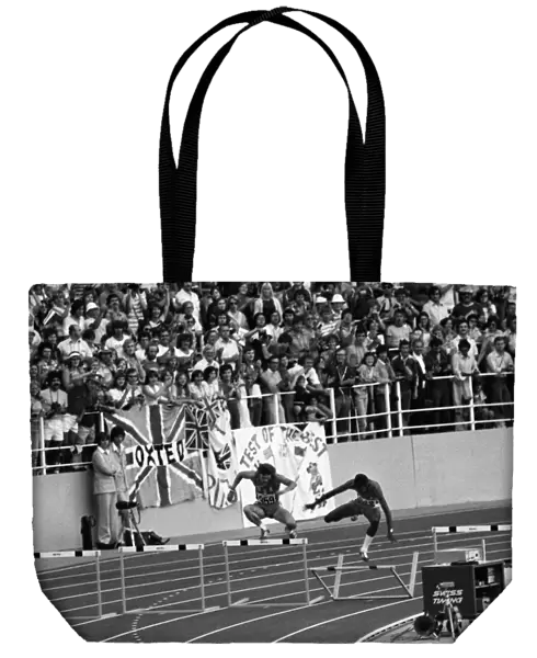 Ed Moses clatters into the hudle on his victory lap after winning gold at the 1976 Montreal Olympics