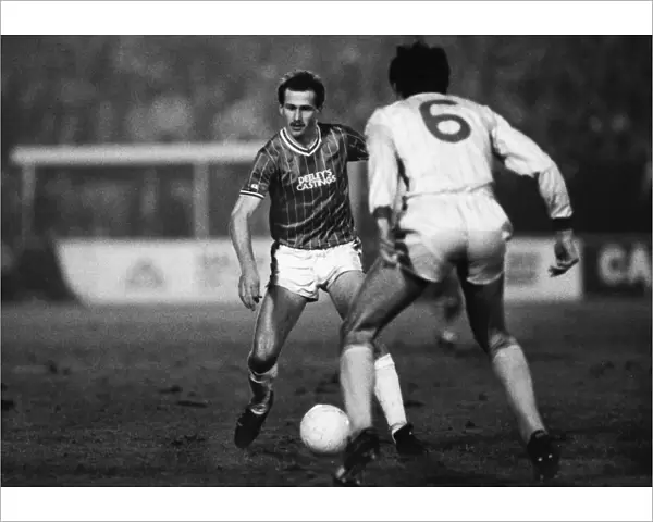 Walsalls Richard O Kelly runs at Liverpools Alan Hansen during the 1983  /  4 League Cup semi-final