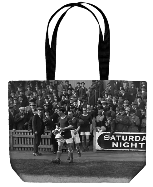 Cardiff City captain Fred Keenor leads his side onto the field with the FA Cup in 1927