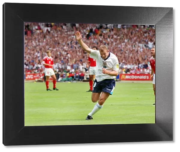 Alan Shearer celebrates scoring the opening goal of Euro 96
