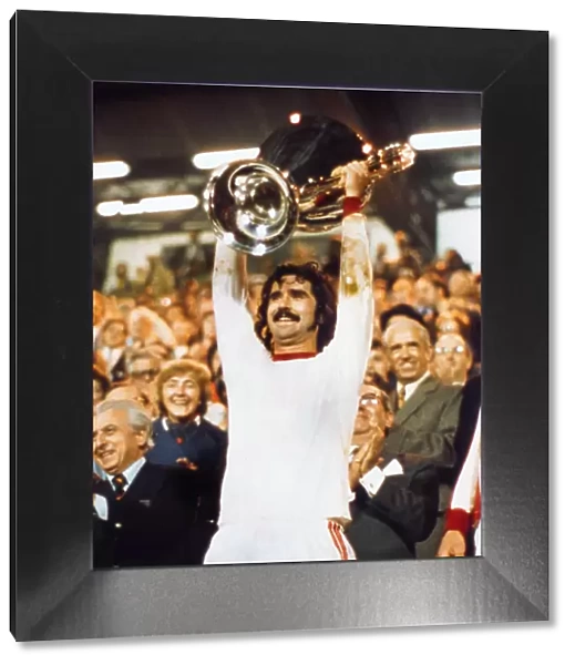 Bayern Munichs Gerd Muller lifts the European Cup in 1974
