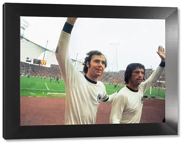 Franz Beckenbauer and Gerd Muller celebrate winning the 1974 World Cup