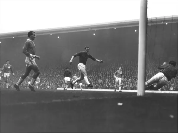 Manchester Uniteds David Herd scores against Liverpool in 1964  /  5