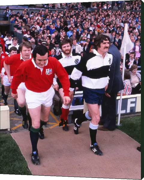 Phil Bennett leads out the British Lions while his Welsh teammate Gerald Davies captains the Barbarians in the 1977 Silver Jubilee Match
