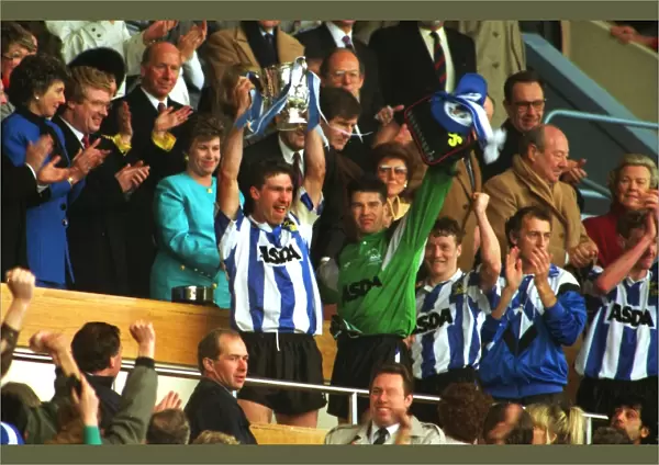 Sheffield Wednesday captain Nigel Pearson holds aloft the League Cup in 1991