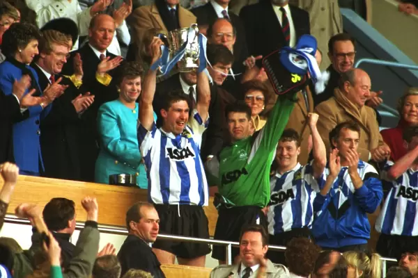 Sheffield Wednesday captain Nigel Pearson holds aloft the League Cup in 1991