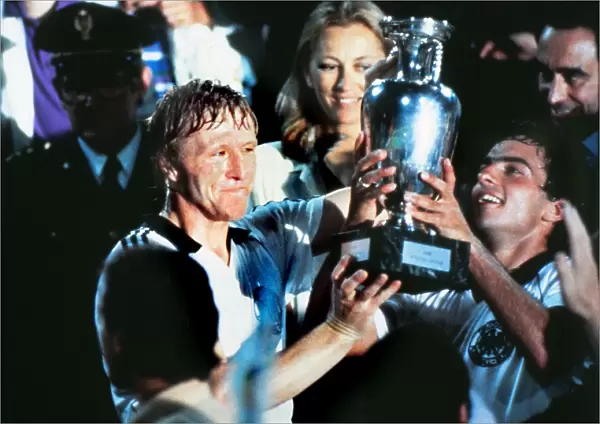 West Germanys Horst Hrubesch and Hans Mueller lift the trophy at Euro 1980