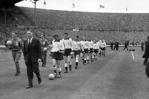 Tottenham Hotspur manager Bill Nicholson leads his Tottenham team onto the pitch for the 1961 FA Cup Final