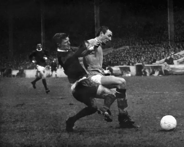 Bobby Noble and Mike Summerbee compete for the ball in the 1966  /  7 Manchester derby at Maine Road
