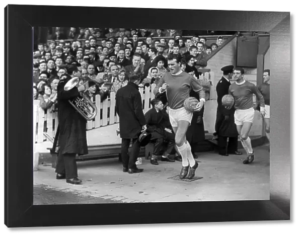 Noel Cantwell leads out Manchester United during the 1963 FA Cup
