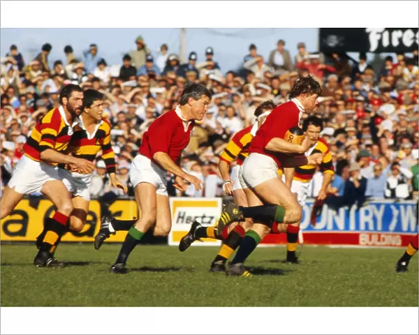 Steve Bainbridge makes a break for the British Lions with Eddie Butler in support in 1983
