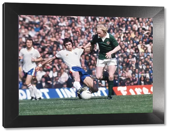 Englands Dave Watson tackles Northern Irelands Derek Spence in 1975