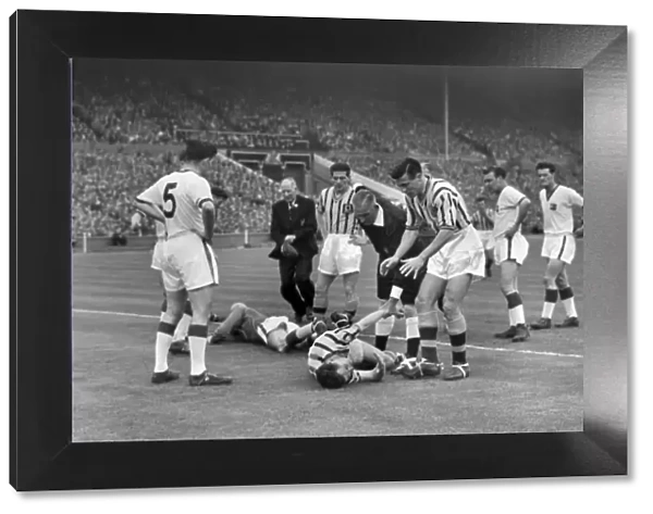 Ray Wood and Peter McParland go down injured in the 1957 FA Cup Final